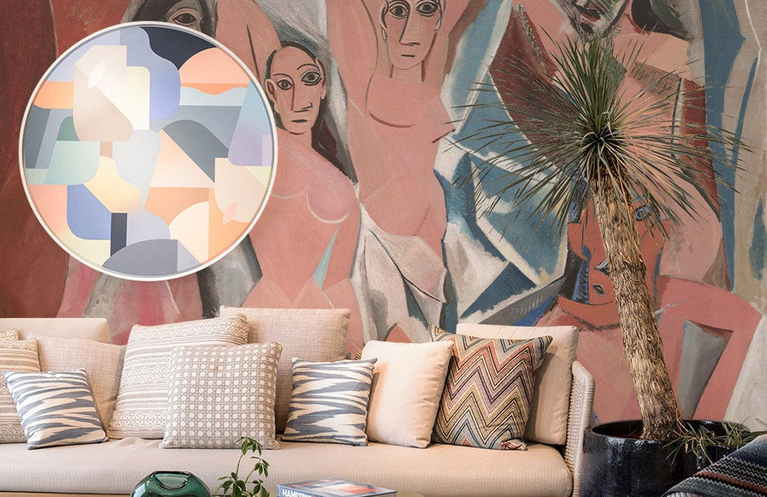Cubist-style mural wallpaper, earthy tones, beige sofa, patterned cushions, modern living room setting.