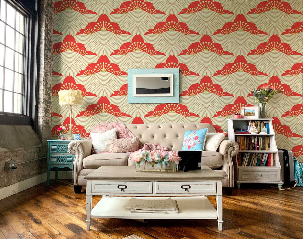 Elegant red and cream fan pattern wallpaper, beige tufted sofa, hardwood floors, industrial-style living room.