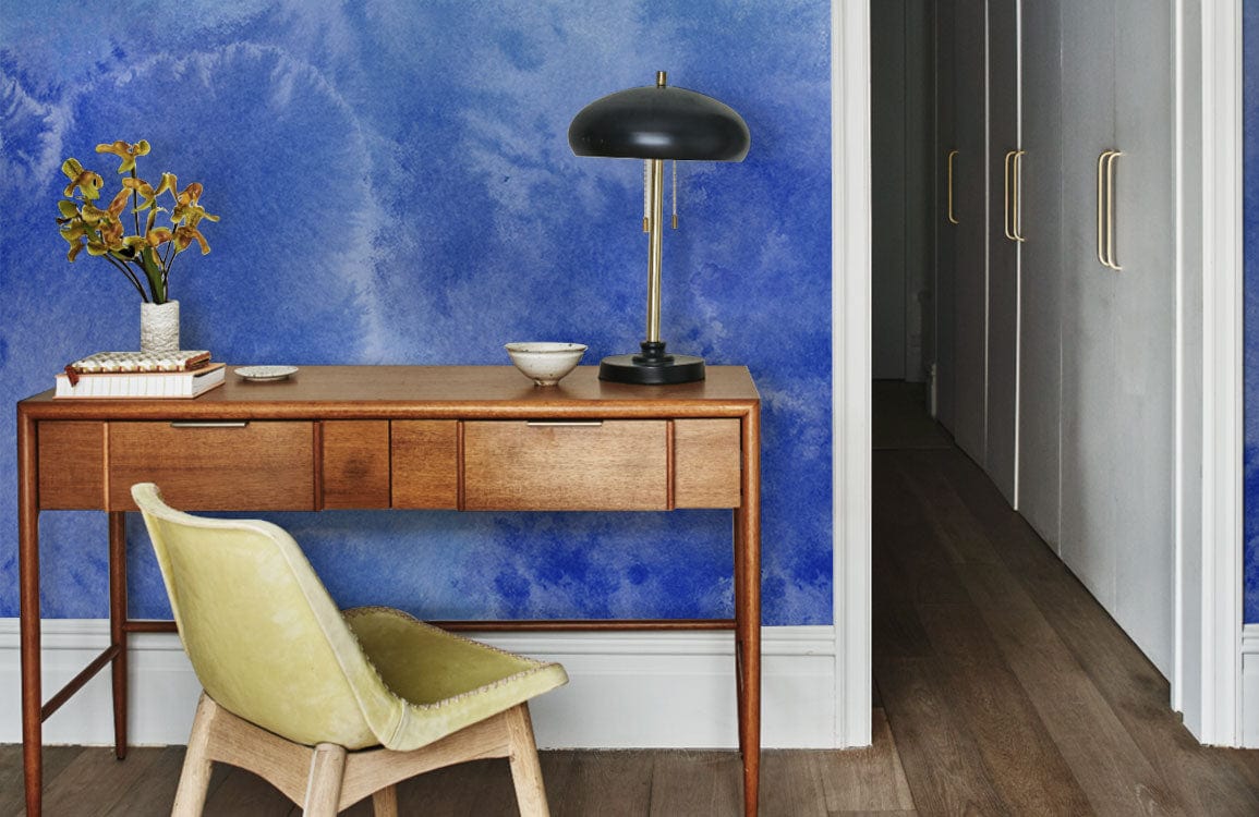 Oceanic Blue Watercolour Mural Wallpaper in study with wooden desk, yellow chair, black lamp, wooden flooring.