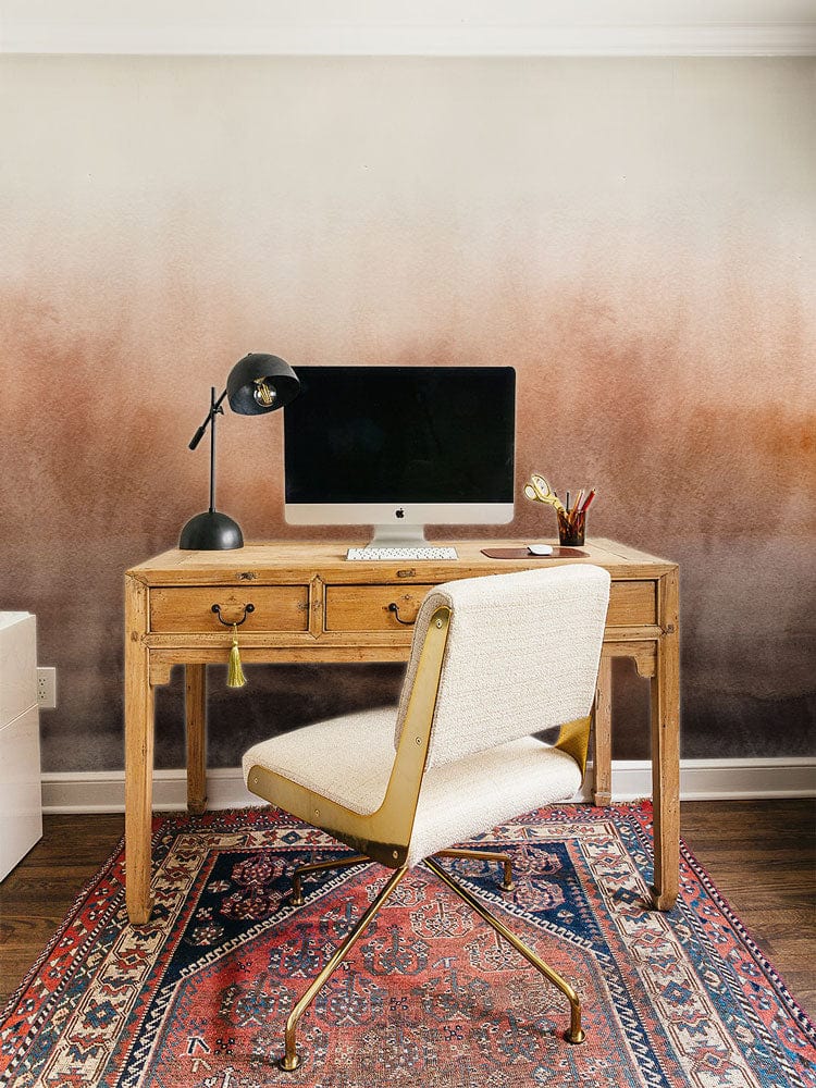 Autumn Mist mural wallpaper, rustic desk, cream chair, colourful rug, dark wood flooring, home office design.