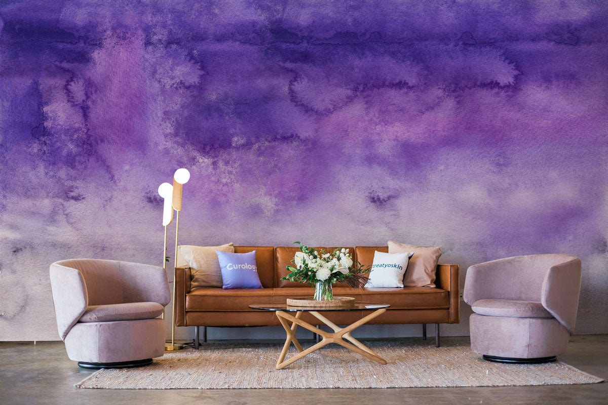 Dreamy Purple Ombre Mural Wallpaper with brown sofa, modern chairs, and wooden coffee table in lounge.
