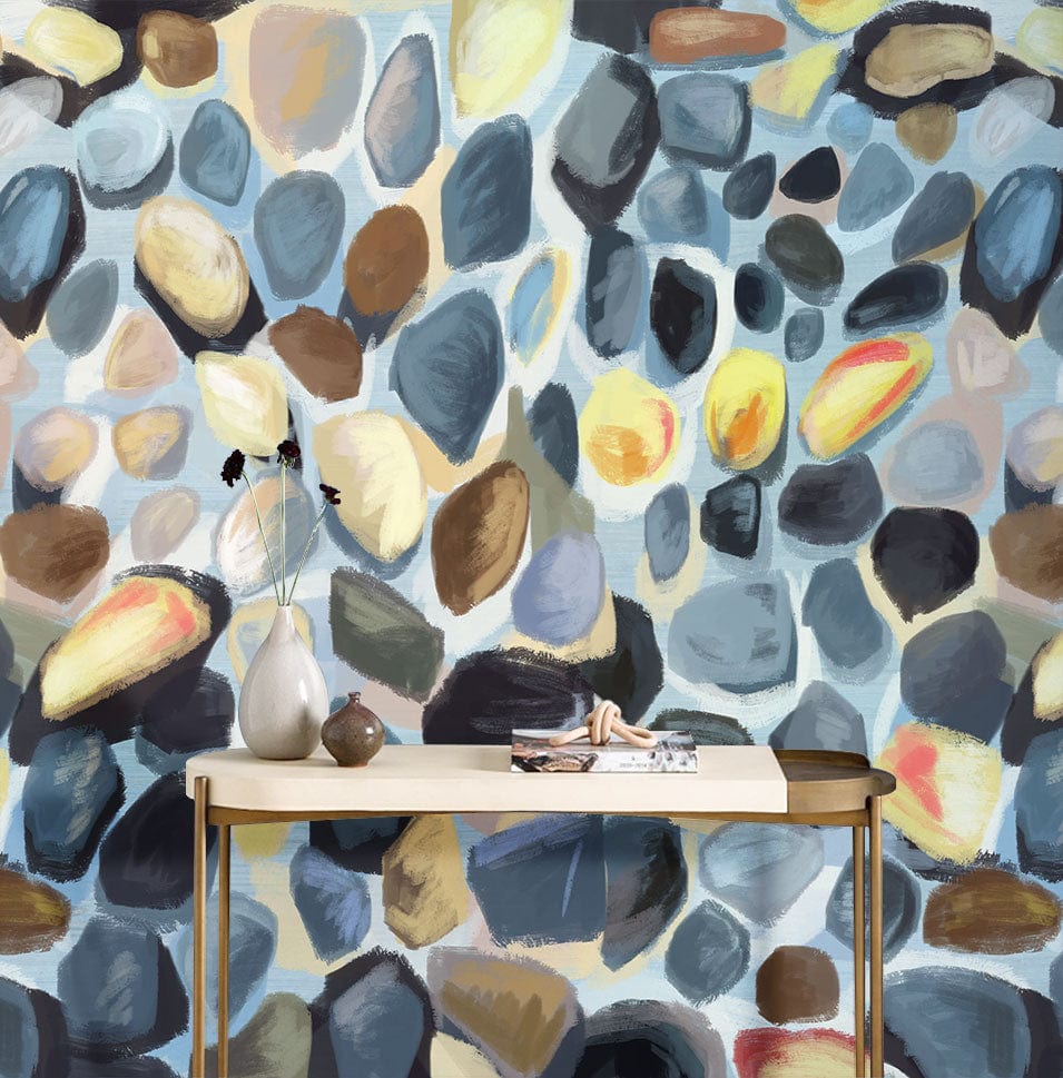 Contemporary multicoloured pebble wallpaper in artistic style, modern table, vase; vibrant wall mural design.