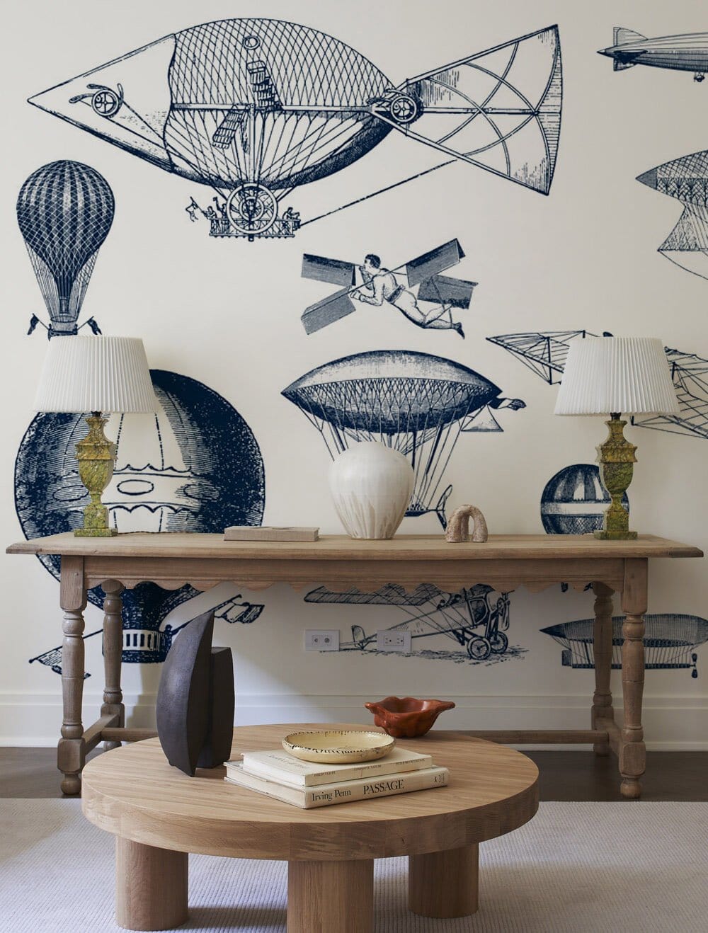 Vintage blue aerial inventions wallpaper in steampunk aviator design. Wooden furniture, neutral room decor.