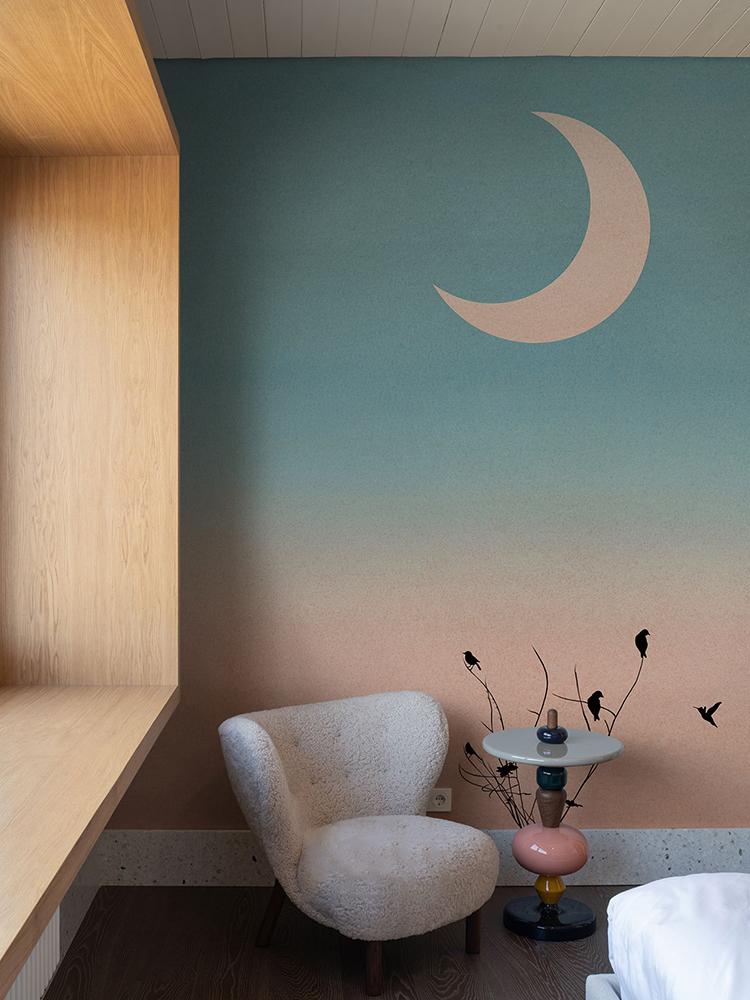 Serene Pastel Sunset Sky Wallpaper, crescent moon, cosy chair, wooden accent, dark flooring, decorative table.