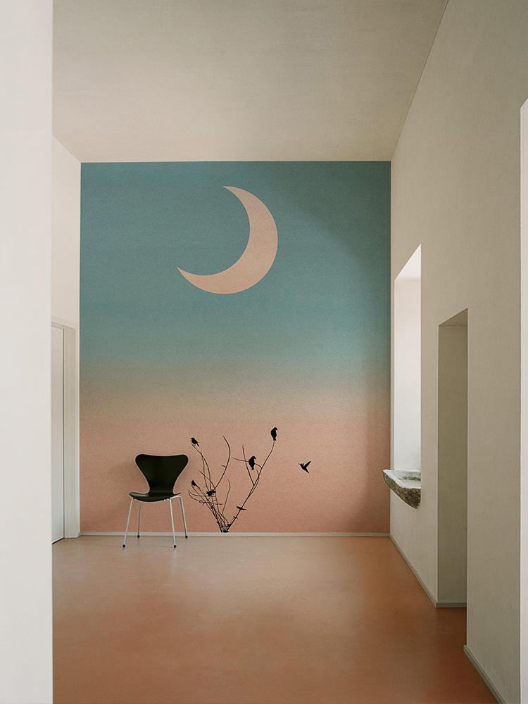 Serene Pastel Sunset Wallpaper with Birds, Crescent Moon, Black Chair in Minimalist Room, Terracotta Flooring.