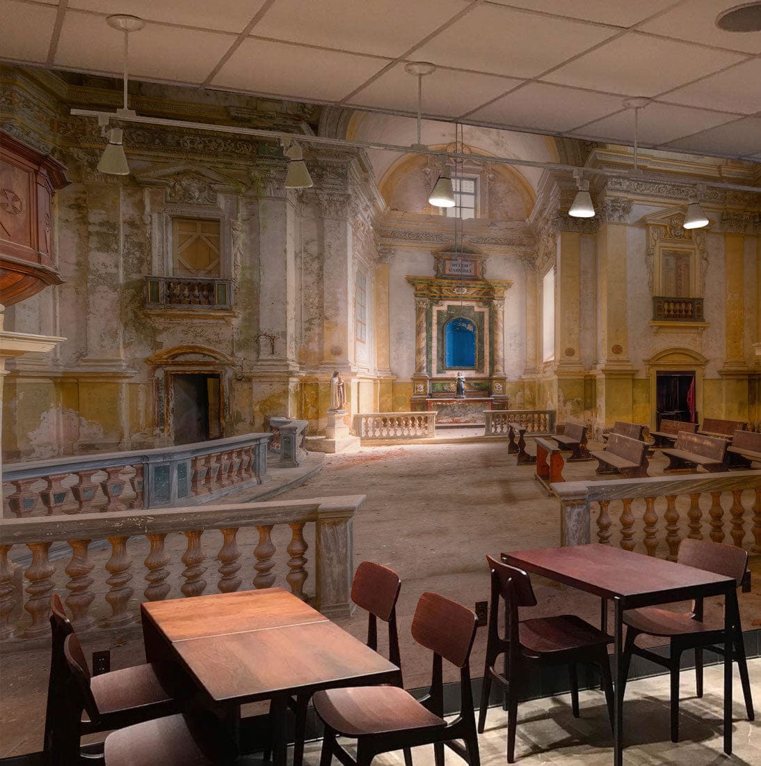 Vintage European Abbey mural in a café; wooden tables, chairs, and ceiling lights enhance decor.