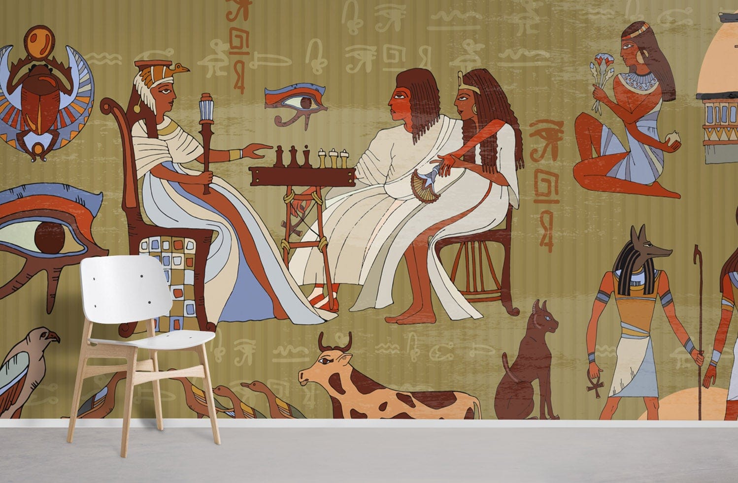 Ancient Egyptian mural wallpaper with earthy tones; modern white chair; minimalist grey flooring in living space.