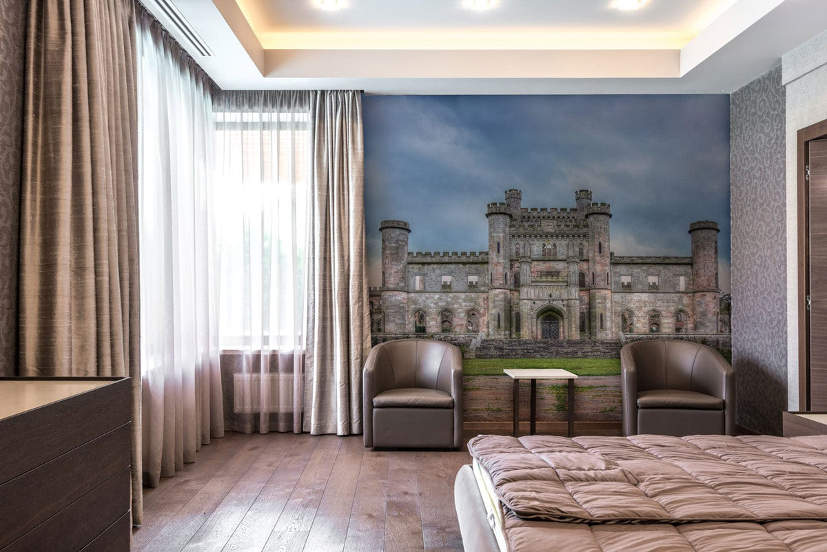 Majestic Stone Castle Mural Wallpaper in bedroom with wooden flooring, taupe armchairs, grey curtains.