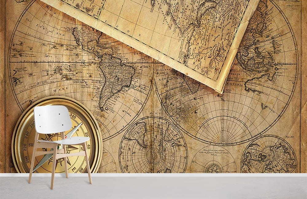 Vintage World Map Wallpaper Mural on beige wall; white chair, compass decor, light wood flooring.