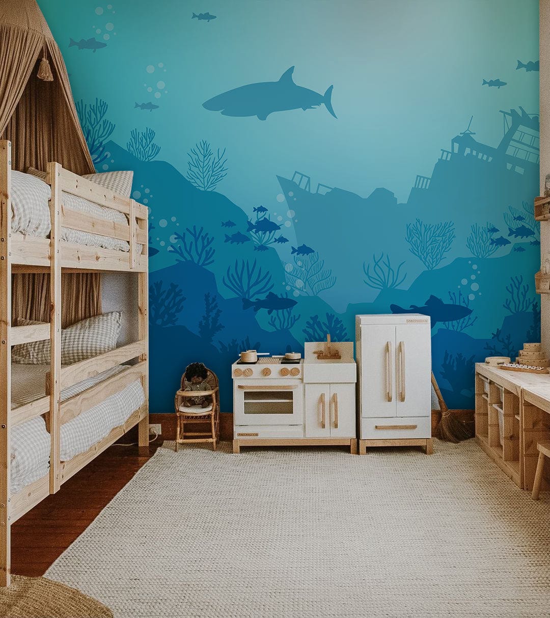 Children's room with Underwater Ocean Adventure Mural Wallpaper, wooden furniture, and textured rug flooring.
