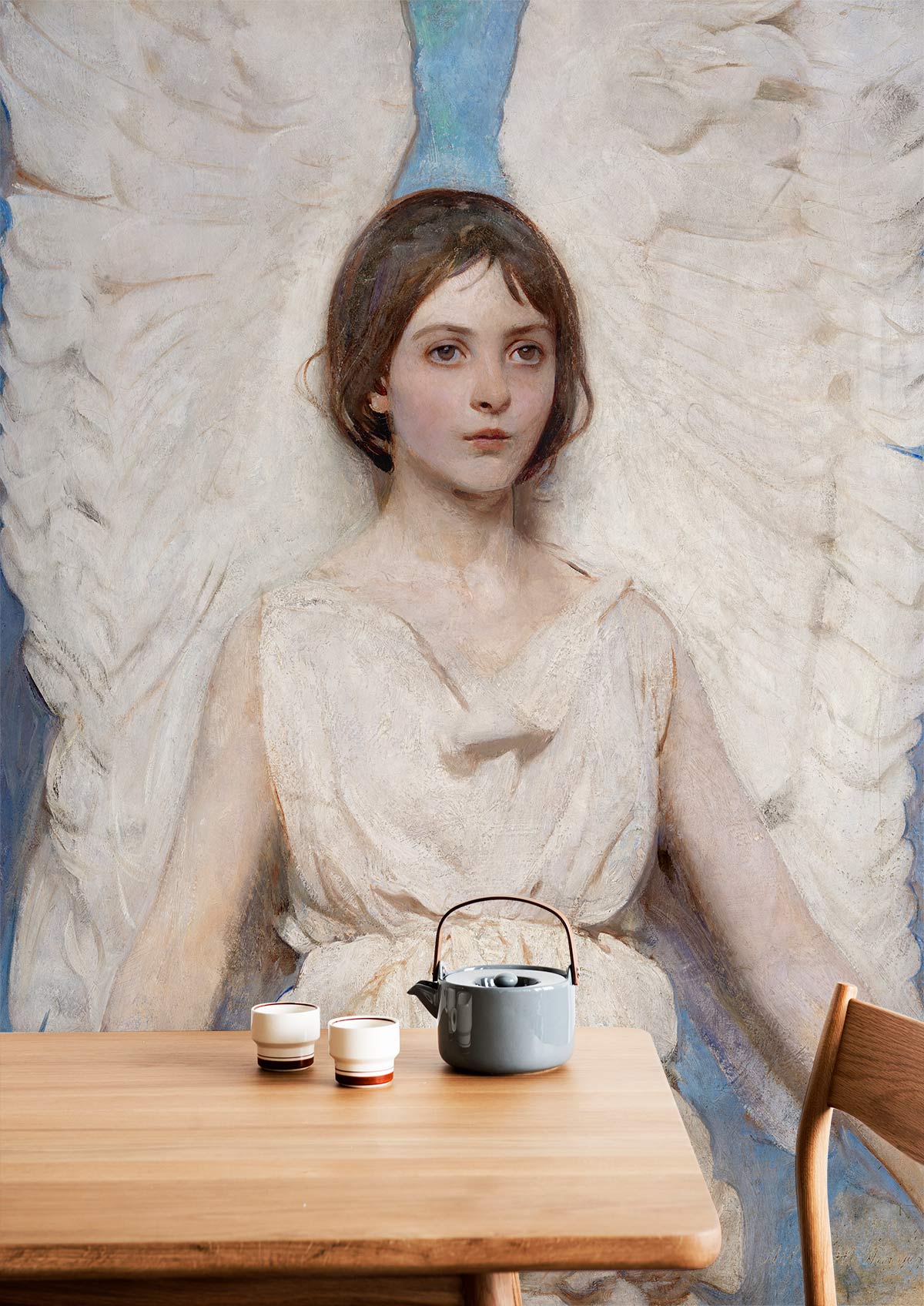 Elegant Angelic Portrait Mural Wallpaper in Pastel Hues, wooden table, modern chair, cosy setting.