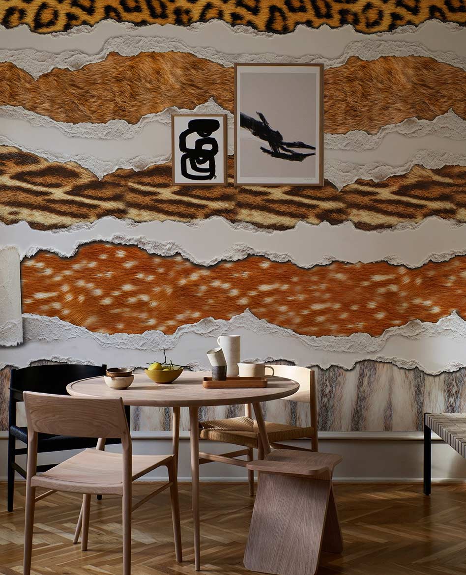 Luxury Safari Animal Print Mural Wallpaper in dining room with brown leather chairs and parquet flooring.
