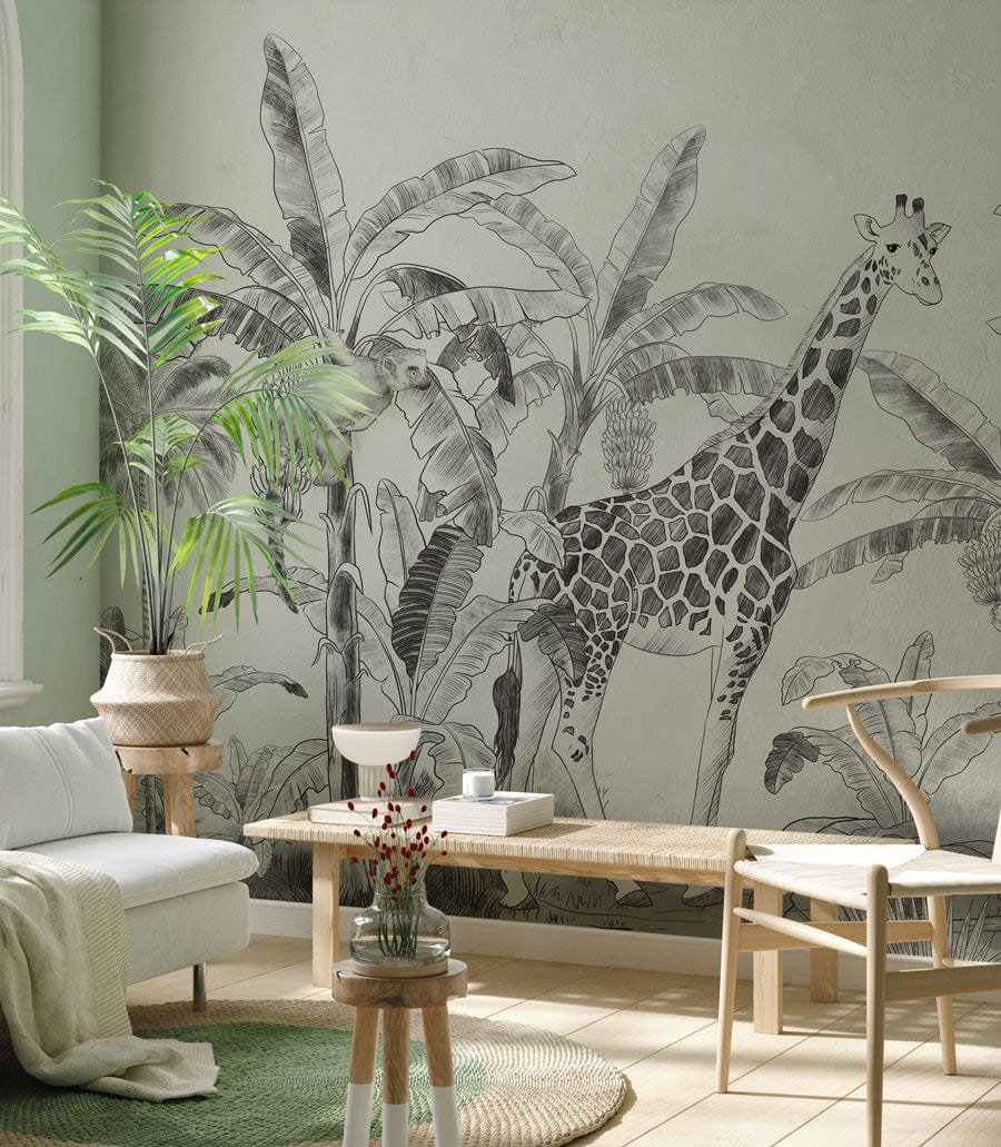 Vintage Safari Jungle Mural Wallpaper with giraffes in monochrome, natural wood furniture, light sofa.