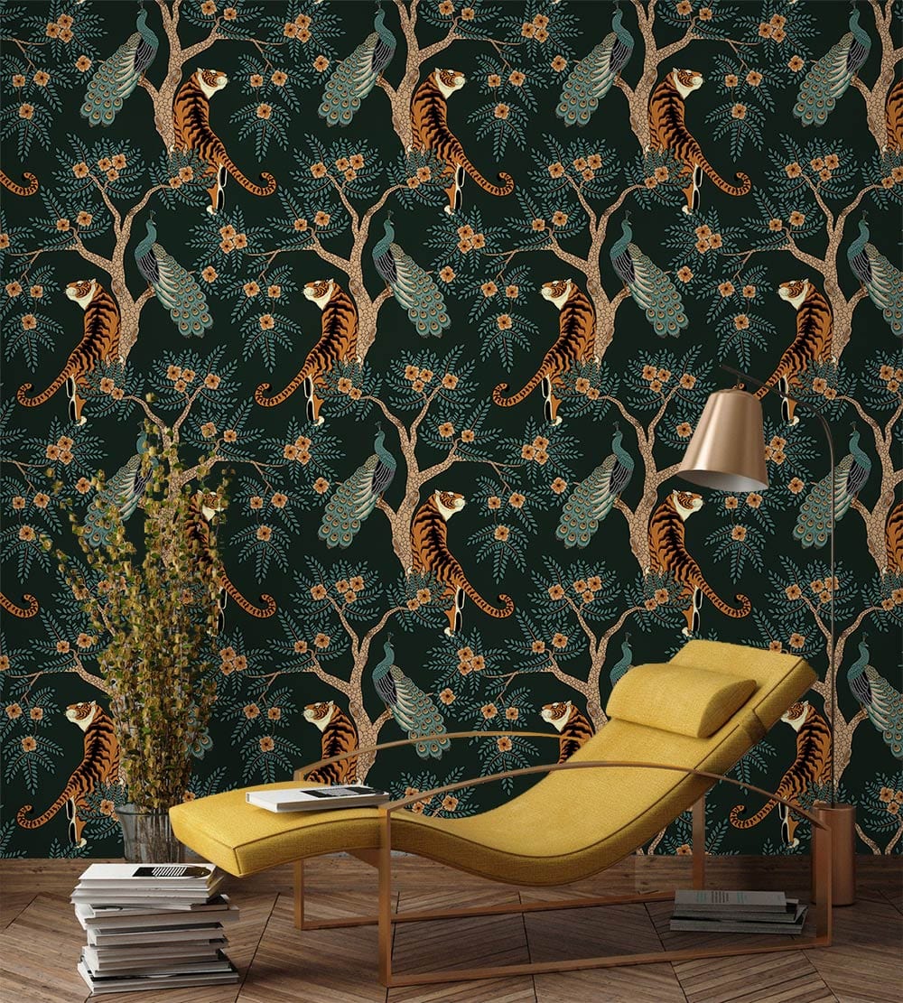 Tropical Jungle Wildlife Dark Green Mural Wallpaper with tigers and peacocks, yellow chaise lounge, wooden flooring.