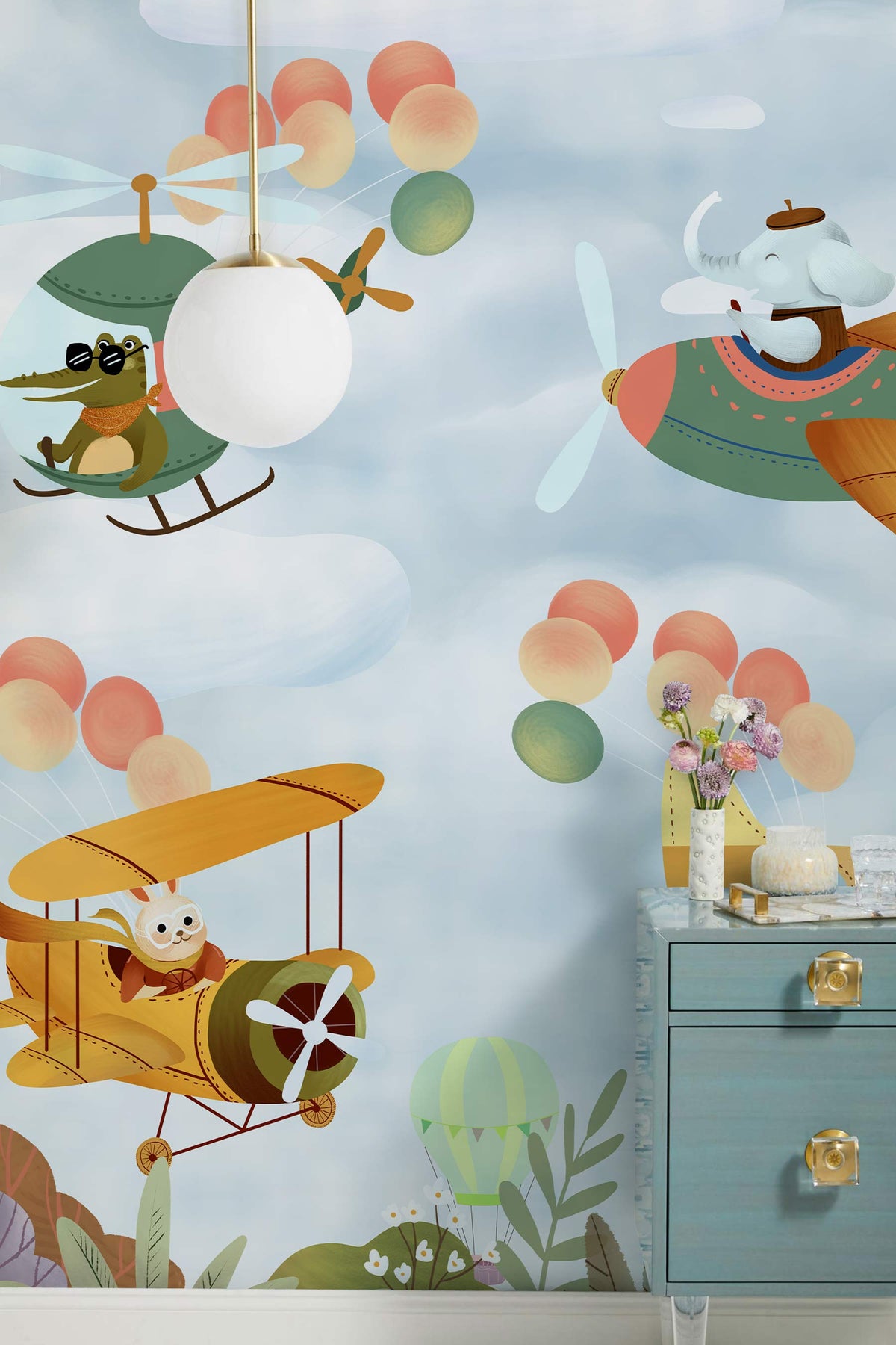 Whimsical Animal Pilots Mural Wallpaper featuring vintage aeroplanes in children's room with blue dresser.