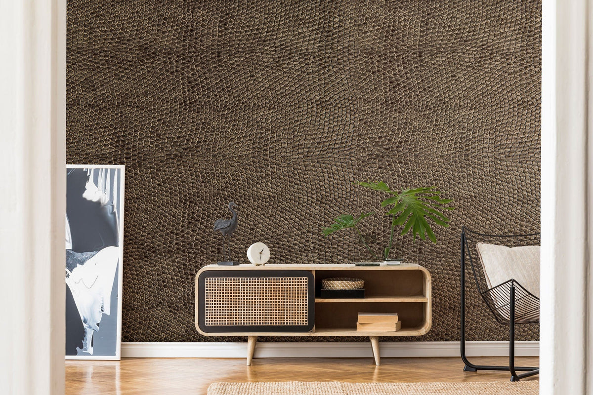 Elegant textured brown leather-look wallpaper, modern sideboard, artwork, chair, stylish wooden flooring, living room.