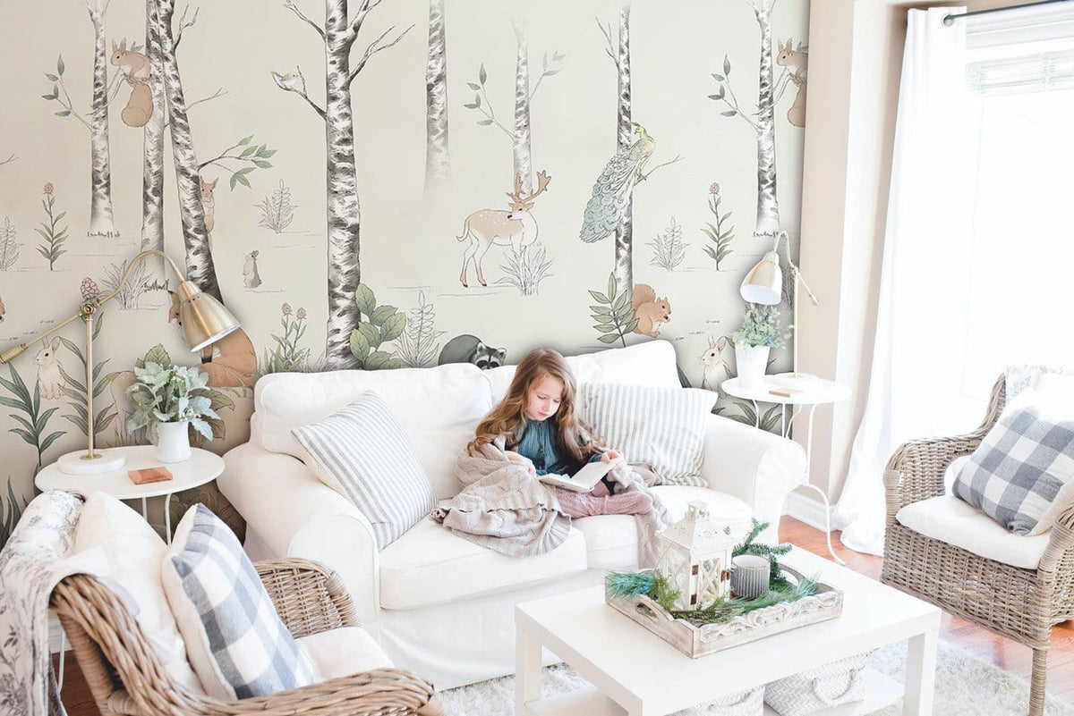 Whimsical Woodland Creatures mural wallpaper; pastel tones in cosy living room with white sofa, rattan chairs.