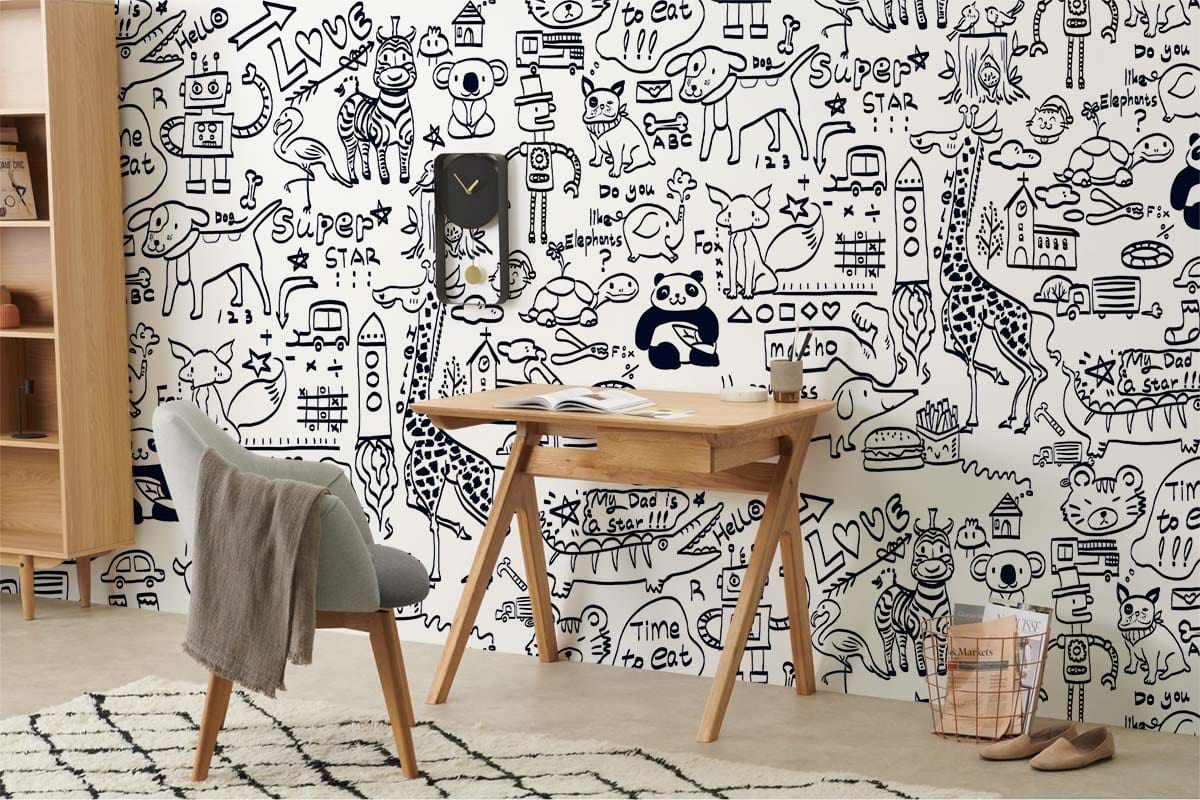 Whimsical animal pattern wallpaper in kids' room with grey chair, wooden desk, and rug on floor.