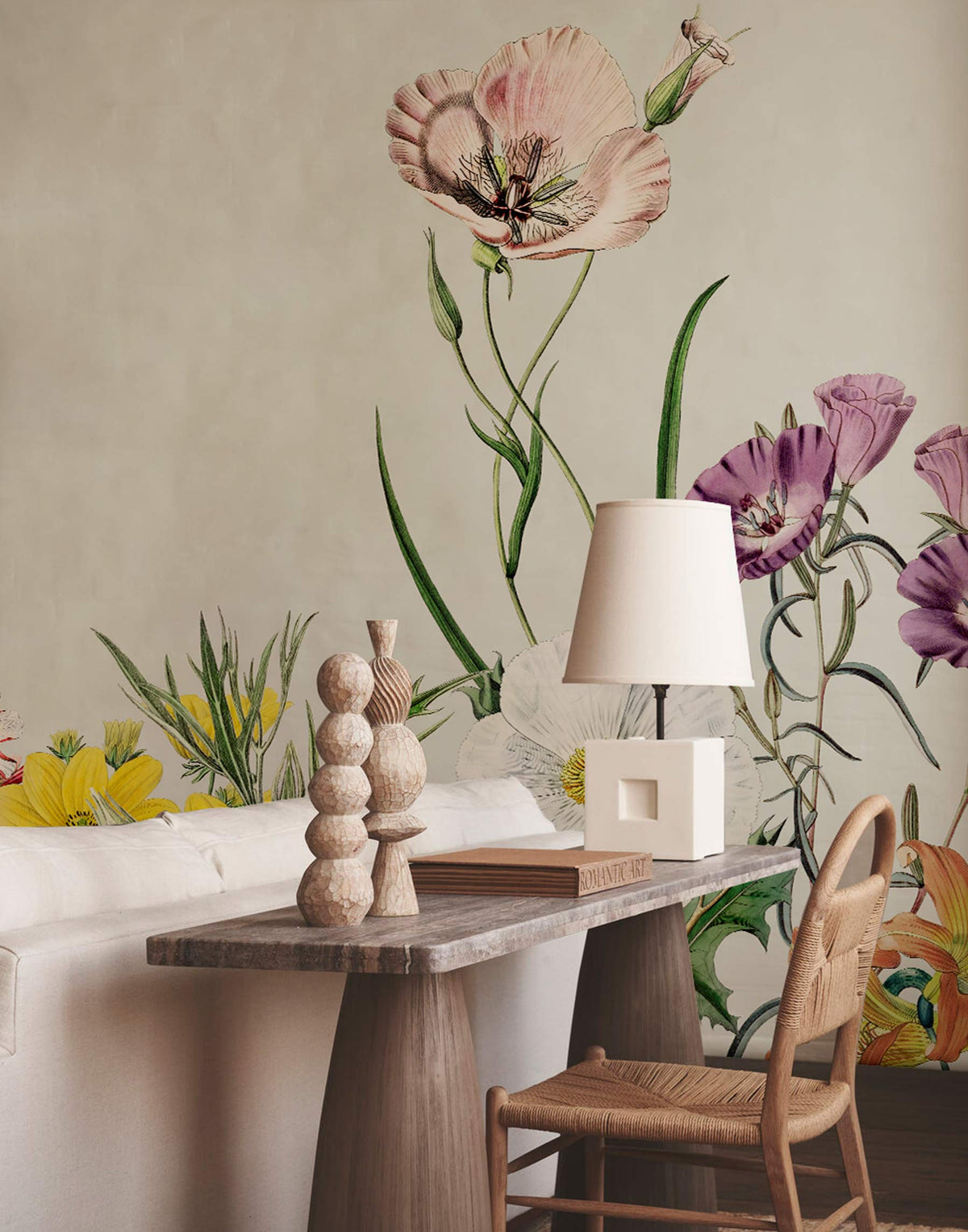Vintage botanical floral mural wallpaper in pastel green, multicolour; rustic dining room with wooden furniture.