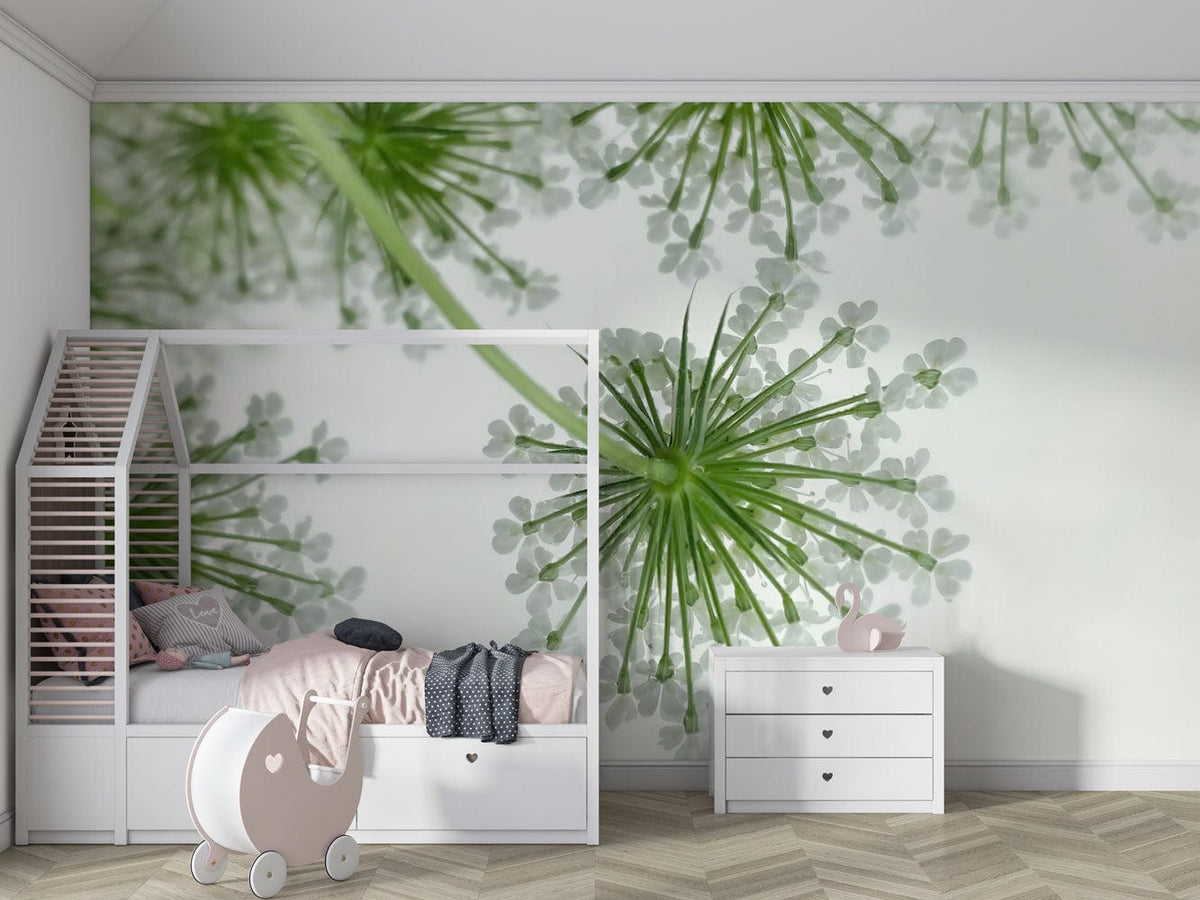 Serene Green Floral Burst Wallpaper in child's bedroom with white bed, chevron flooring, dresser.