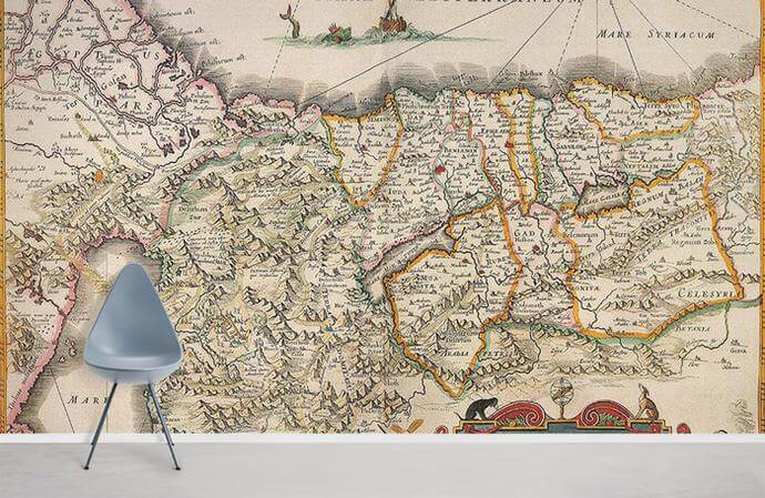 Vintage map mural wallpaper in earthy tones, white floor, modern grey chair. Historical charm decor.