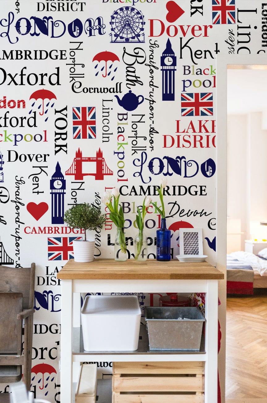 British Iconography wallpaper with red, blue motif; wooden table, rustic room, parquet flooring, decor accents.