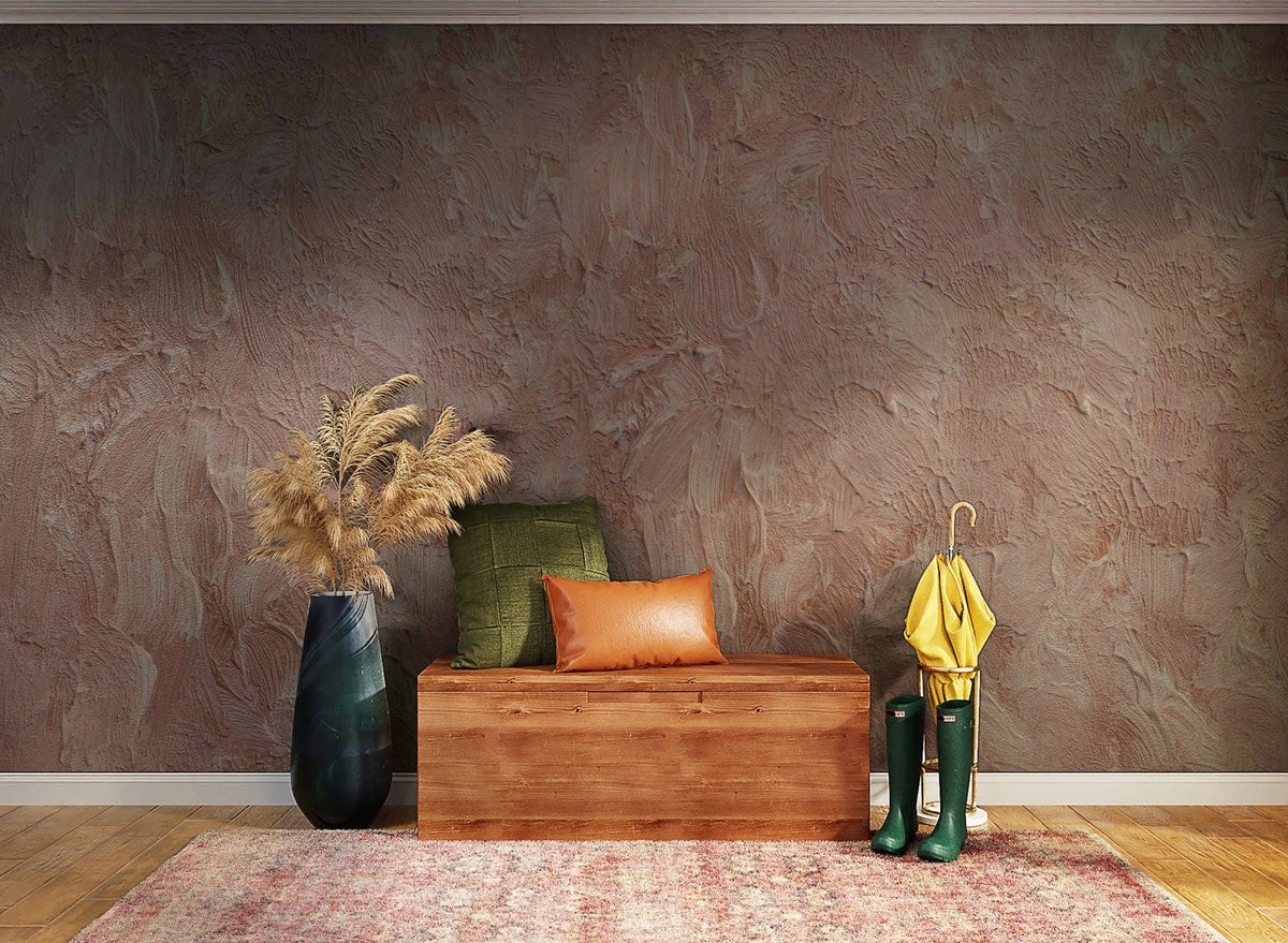 Elegant textured blush pink abstract wallpaper, modern bench, patterned rug, hardwood flooring in stylish entryway.