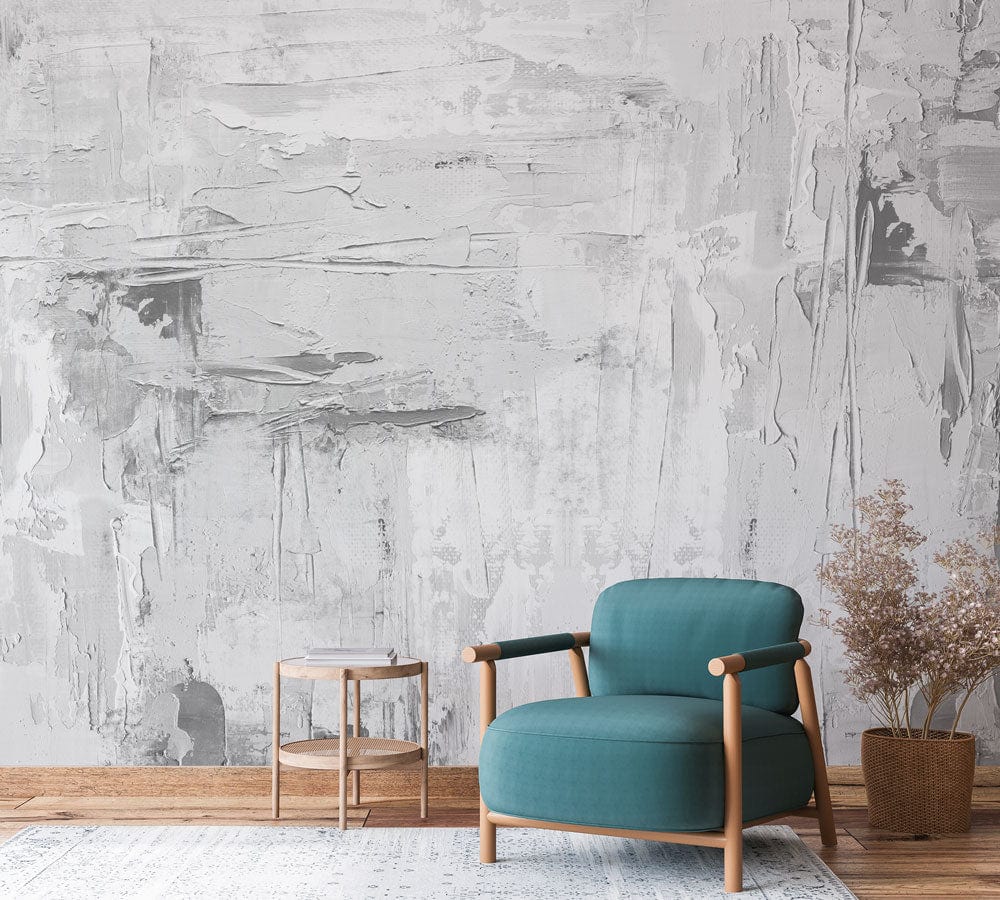 Abstract grey and white mural wallpaper with blue armchair, wooden flooring, minimalist side table, contemporary room.