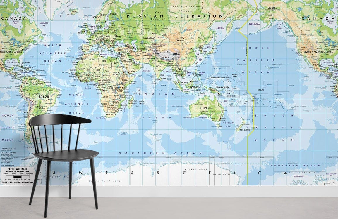 Vintage World Map Mural Wallpaper in cosy room, featuring black chair, grey concrete flooring, vibrant decor.