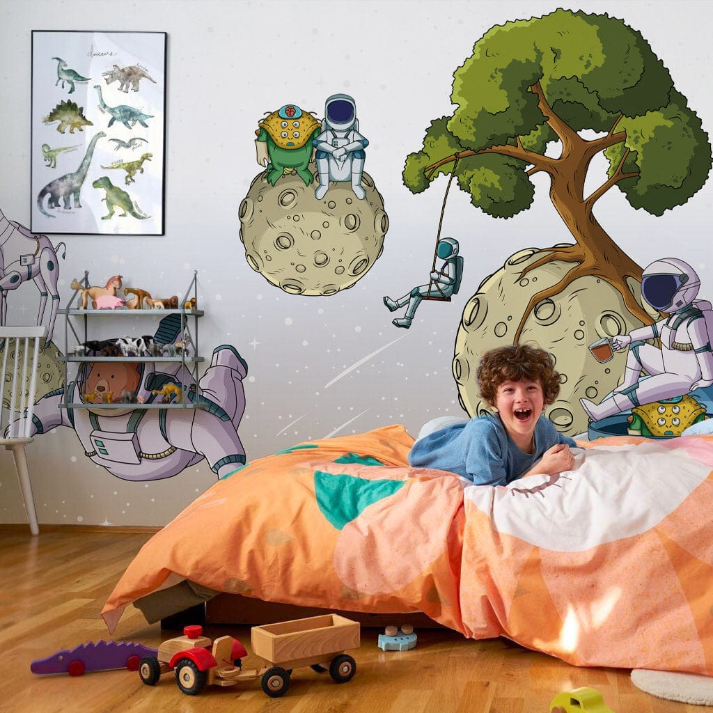 Kids' room with whimsical space mural, orange bedspread, wooden floor, dinosaur poster, playful design.