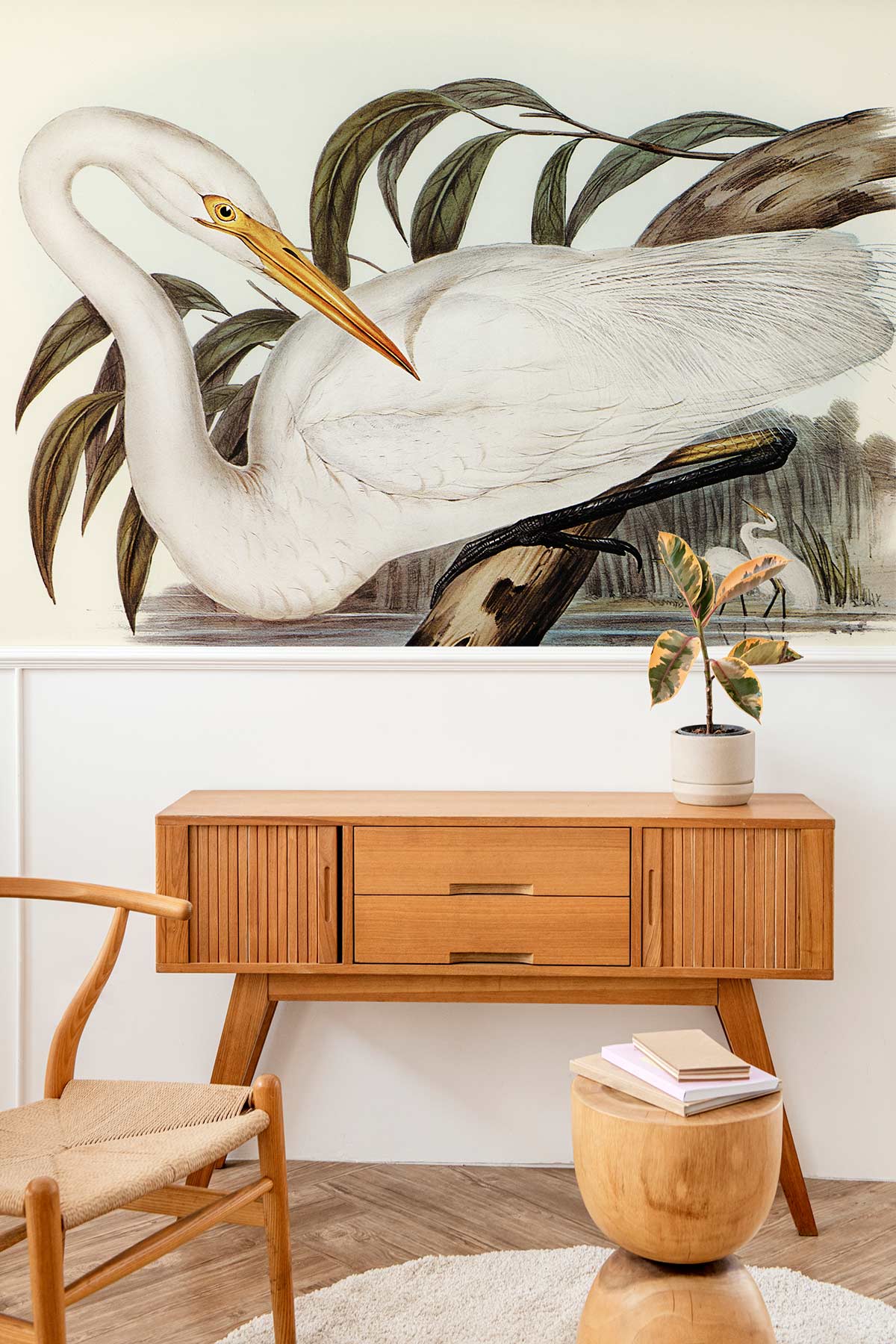 Elegant Heron wallpaper in soft earth tones, mid-century furniture, neutral wood flooring, serene living room.