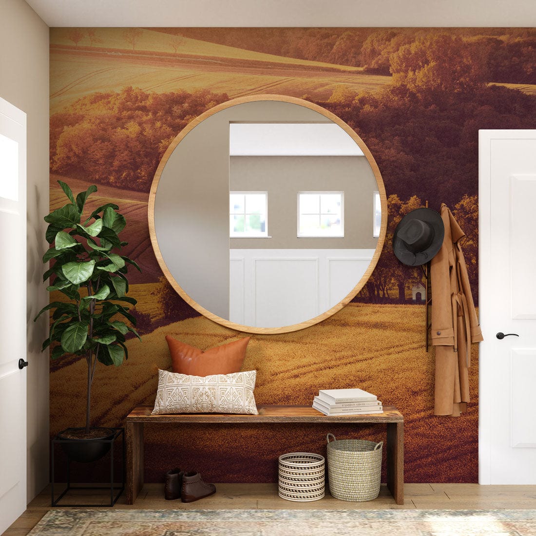 Sunset Golden Fields mural in earthy tones, round mirror, wooden bench, hallway decor, rustic ambiance.