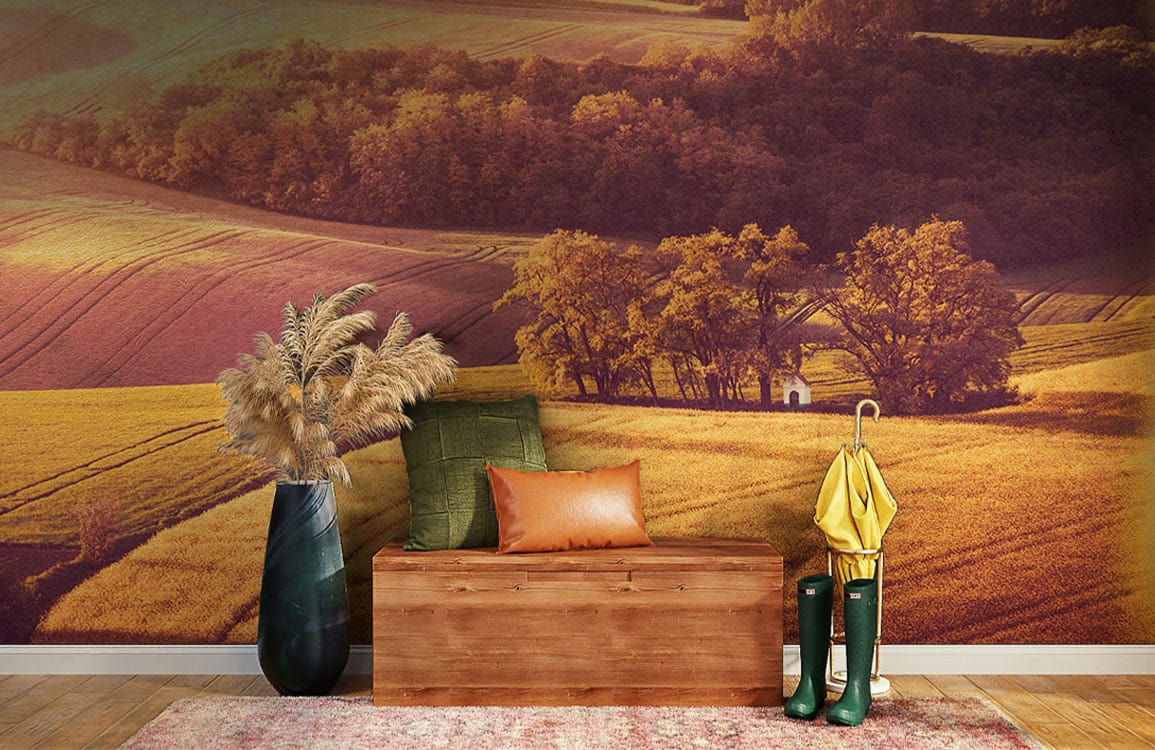 Sunset Golden Fields Mural with wooden bench, green velvet cushion, warm earthy tones, hardwood flooring.