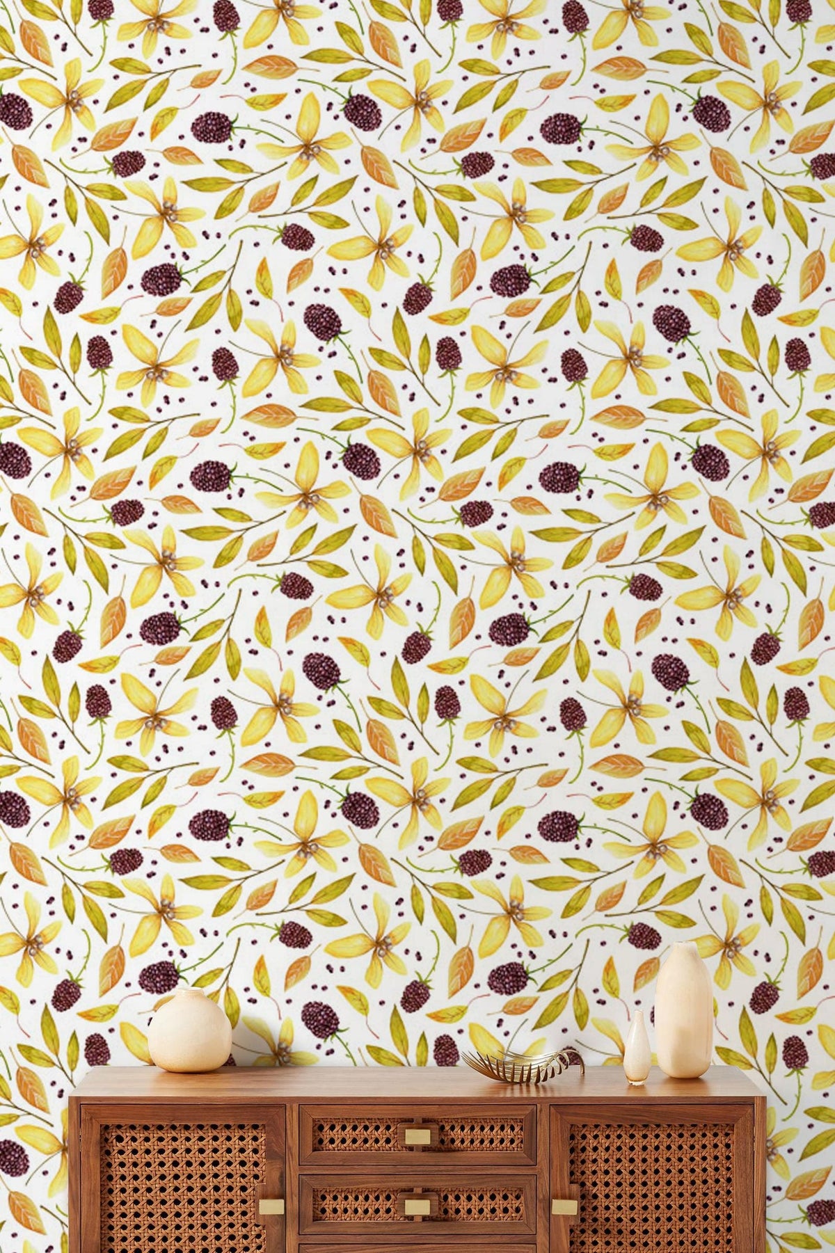 Autumnal leaf wallpaper, yellow-green-brown botanical design, wooden sideboard, decorative white vases.