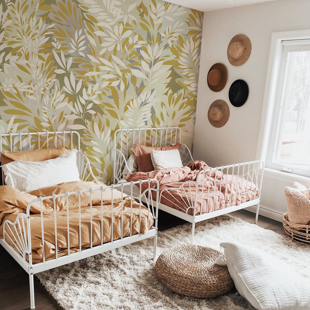 Botanical Oasis Leaf Pattern Wallpaper adorns bedroom with white metal beds, textured rug, wicker decor.