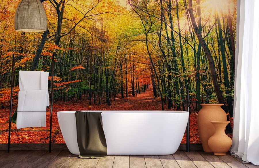 Vibrant Autumn Forest Mural in bathroom with white bathtub, wooden flooring, and natural lighting.