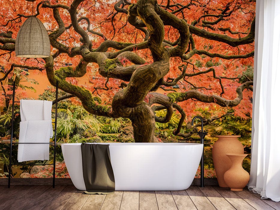 Luxurious bathroom featuring vibrant autumn Japanese maple mural wallpaper, freestanding white tub, wood flooring.