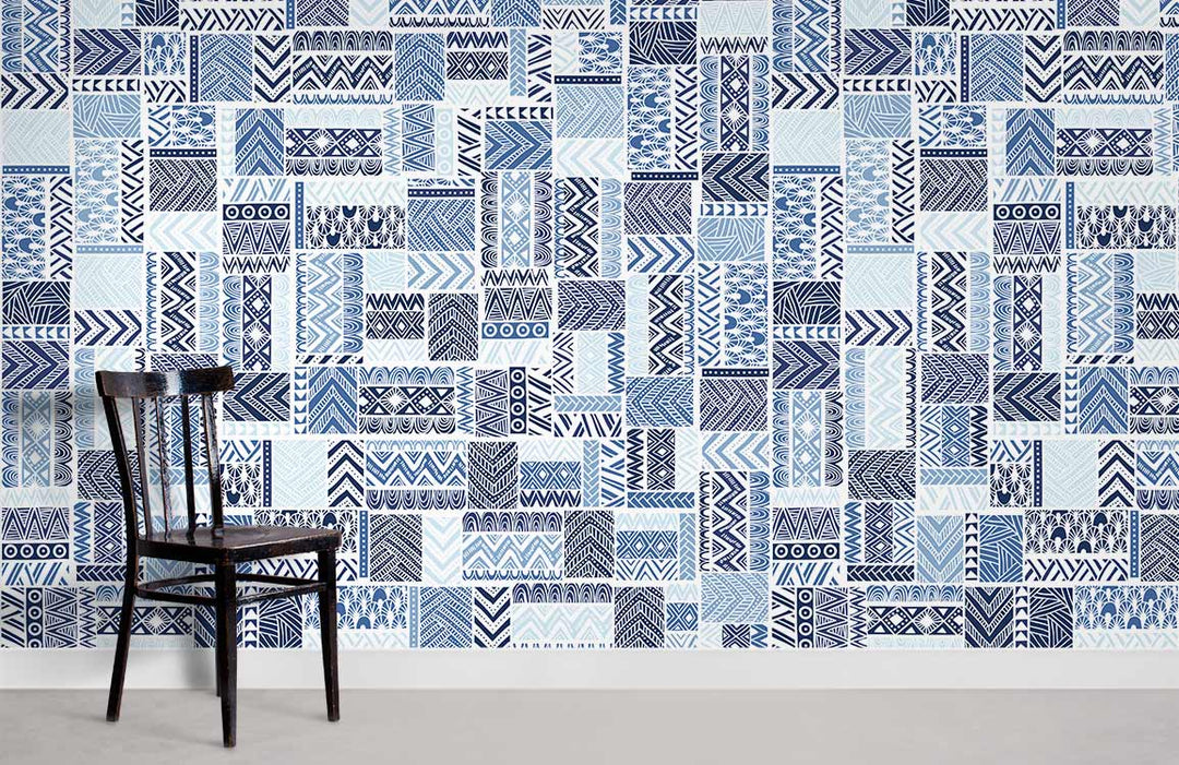 Contemporary blue geometric tribal pattern wallpaper in modern room with wooden chair and grey flooring.