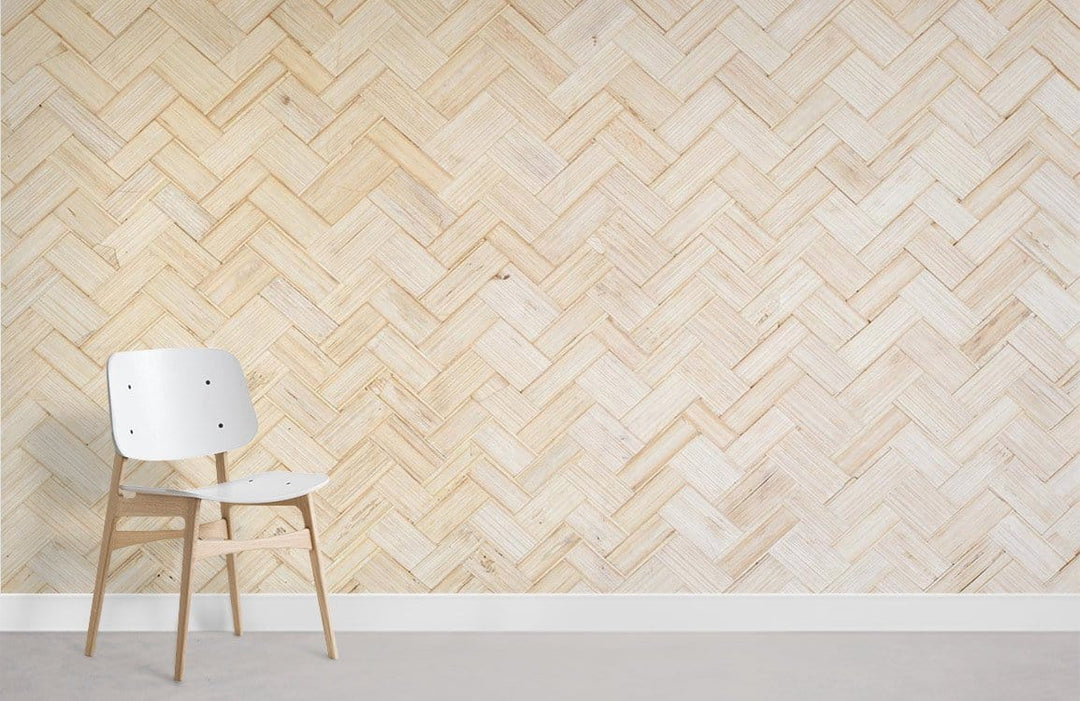 Natural Bamboo Herringbone Wallpaper in light beige, minimalist chair, grey flooring, feature wall design.