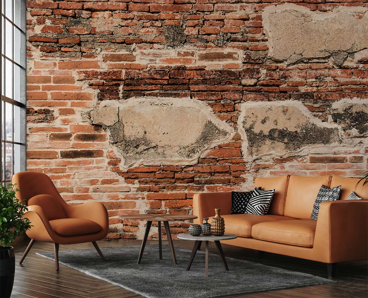 Rustic brick weathered red mural wallpaper, industrial decor, brown leather sofa, wooden flooring, living room.