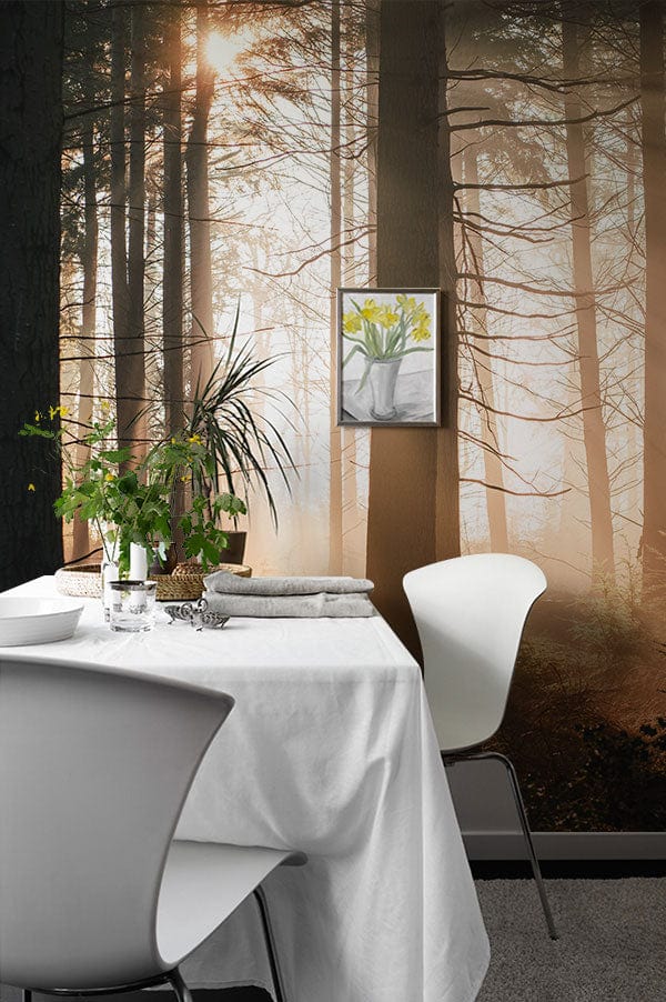 Serene Sunset Forest Mural Wallpaper in dining area, white chairs, grey carpet, peaceful woodland escape.