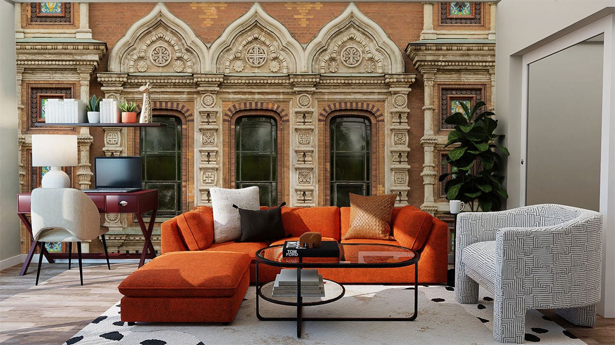 Alt text: Historic brick and stone mural wallpaper, orange sofa, white armchair, wooden floor, modern living room.
