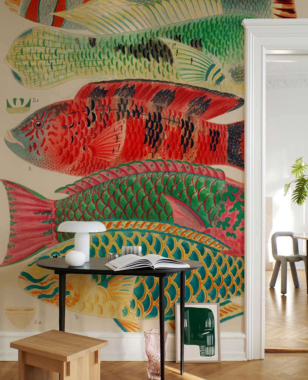 Vibrant tropical fish wallpaper, colourful aquatic mural, light wooden flooring, white walls, modern chair.