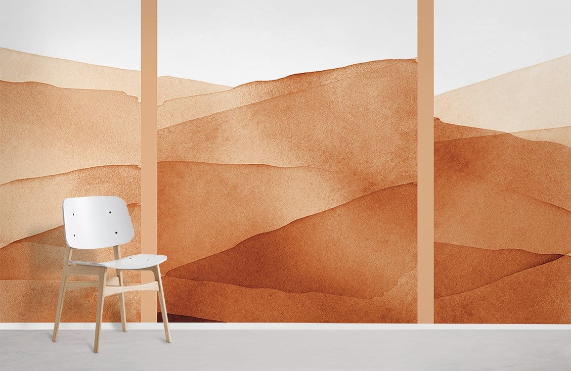 Terracotta Desert Landscape Mural Wallpaper in earthy tones with minimalist chair, modern room decor.