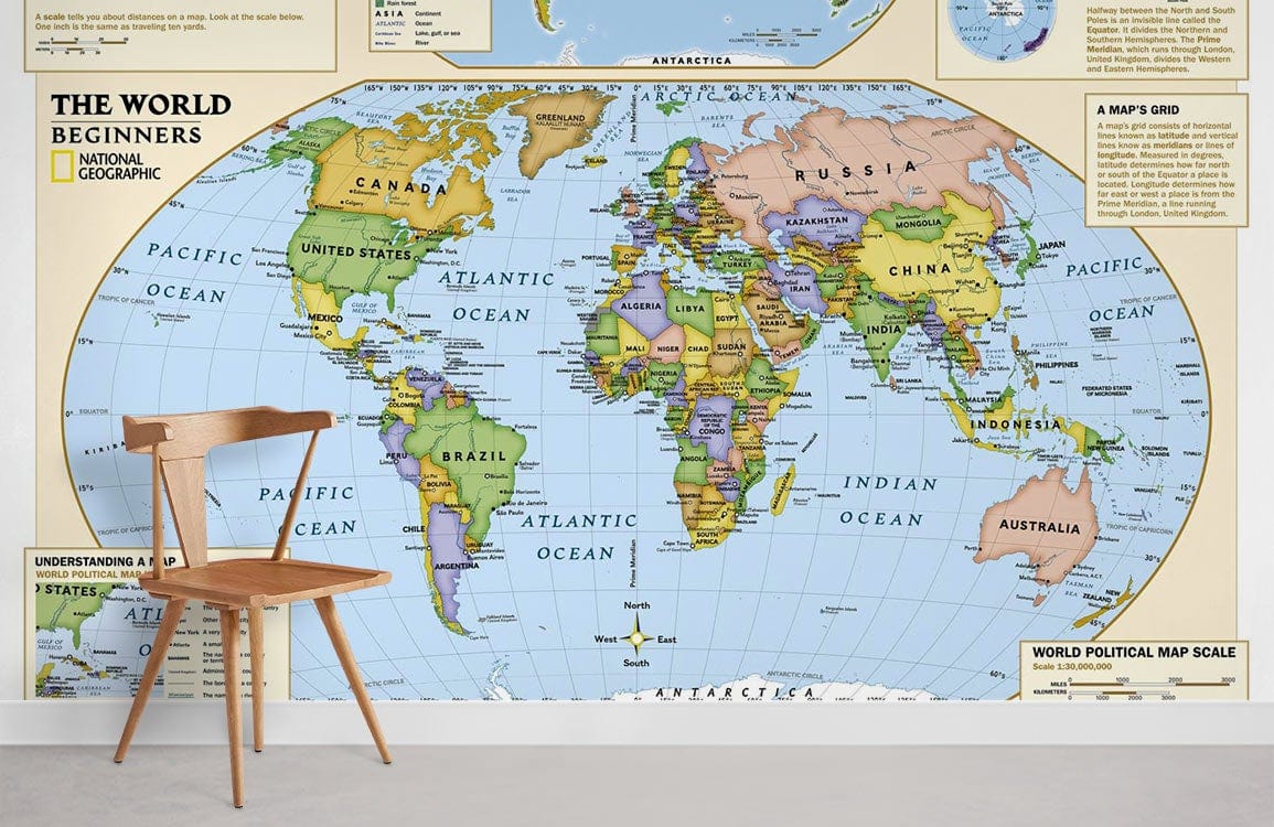 Educational World Map mural by National Geographic; wooden chair, white wall, modern minimalist decor.