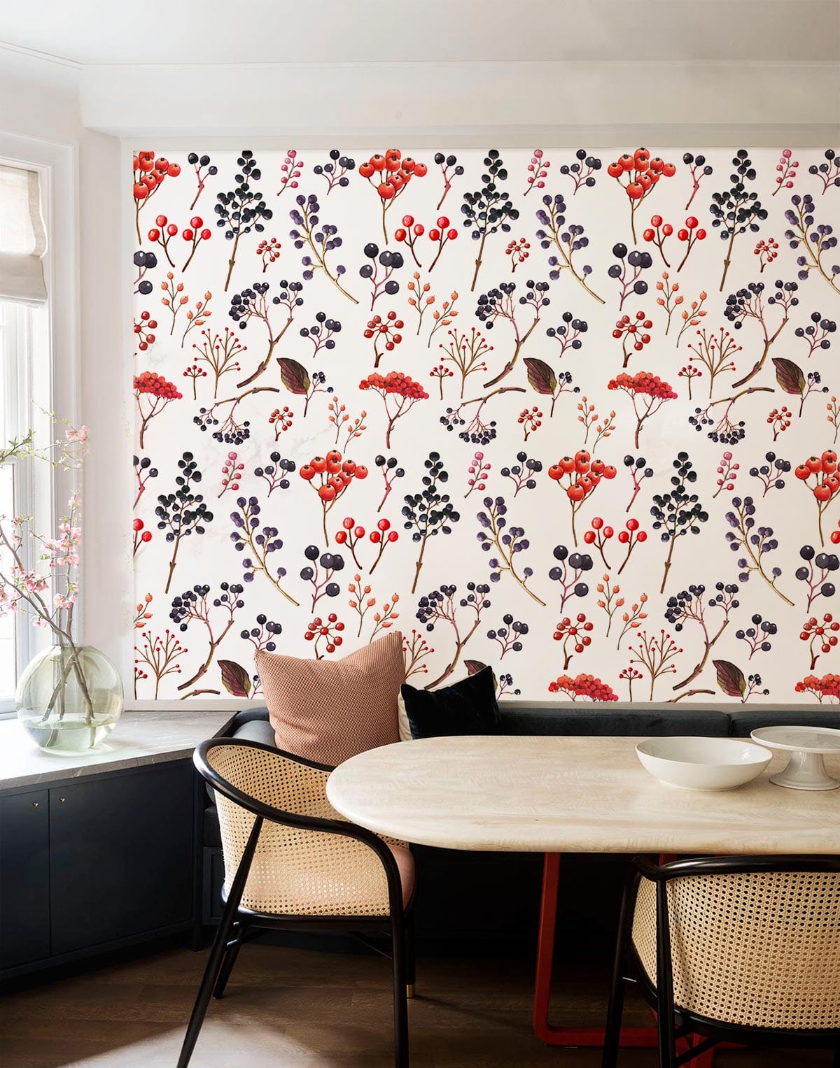 Botanical Berry Bliss floral wallpaper, dining area, white tabletop, rattan chairs, wooden floor, window.