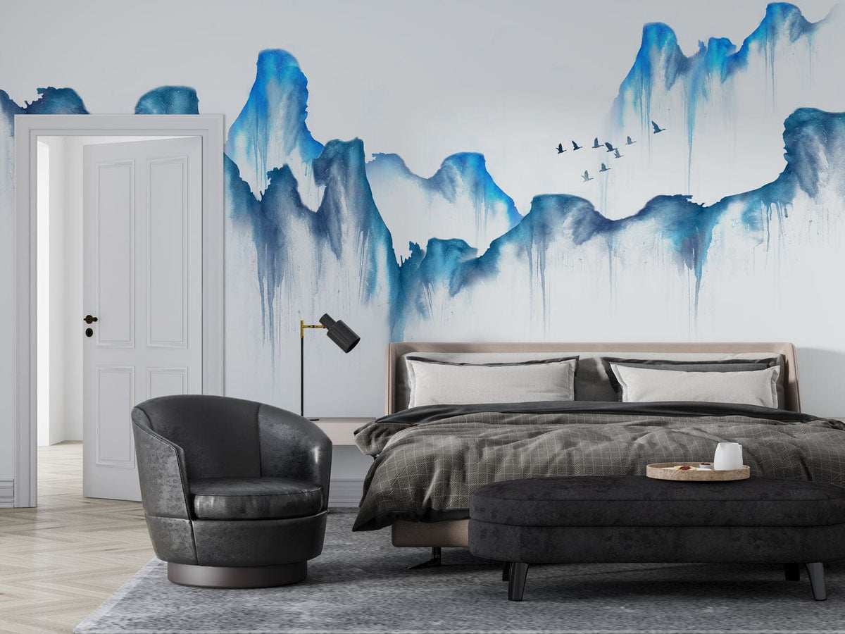 Blue mountain mural wallpaper with birds, grey sofa, luxury bedroom, parquet flooring, serene interior design.