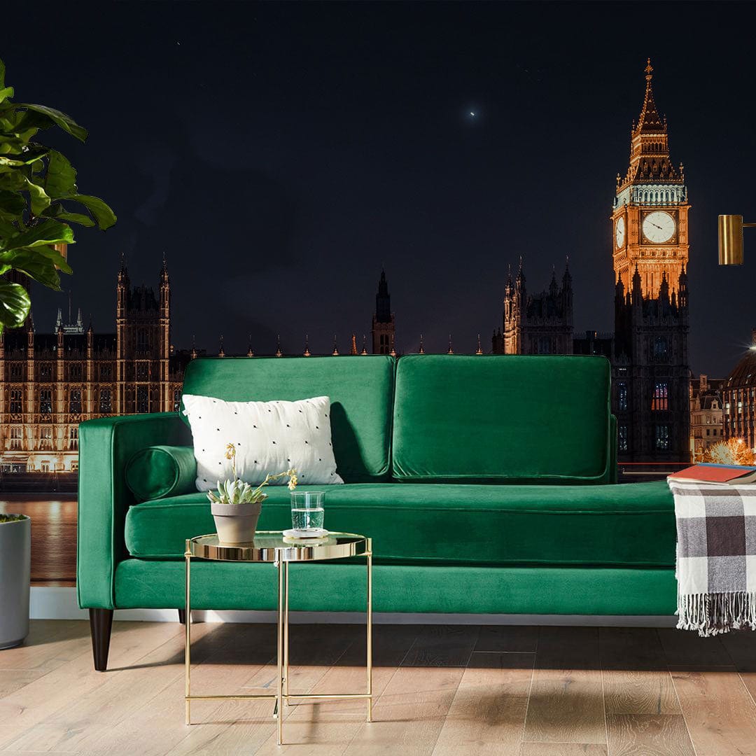 Illuminated London Skyline mural, green sofa, wooden flooring, elegant night-time cityscape in modern living room.