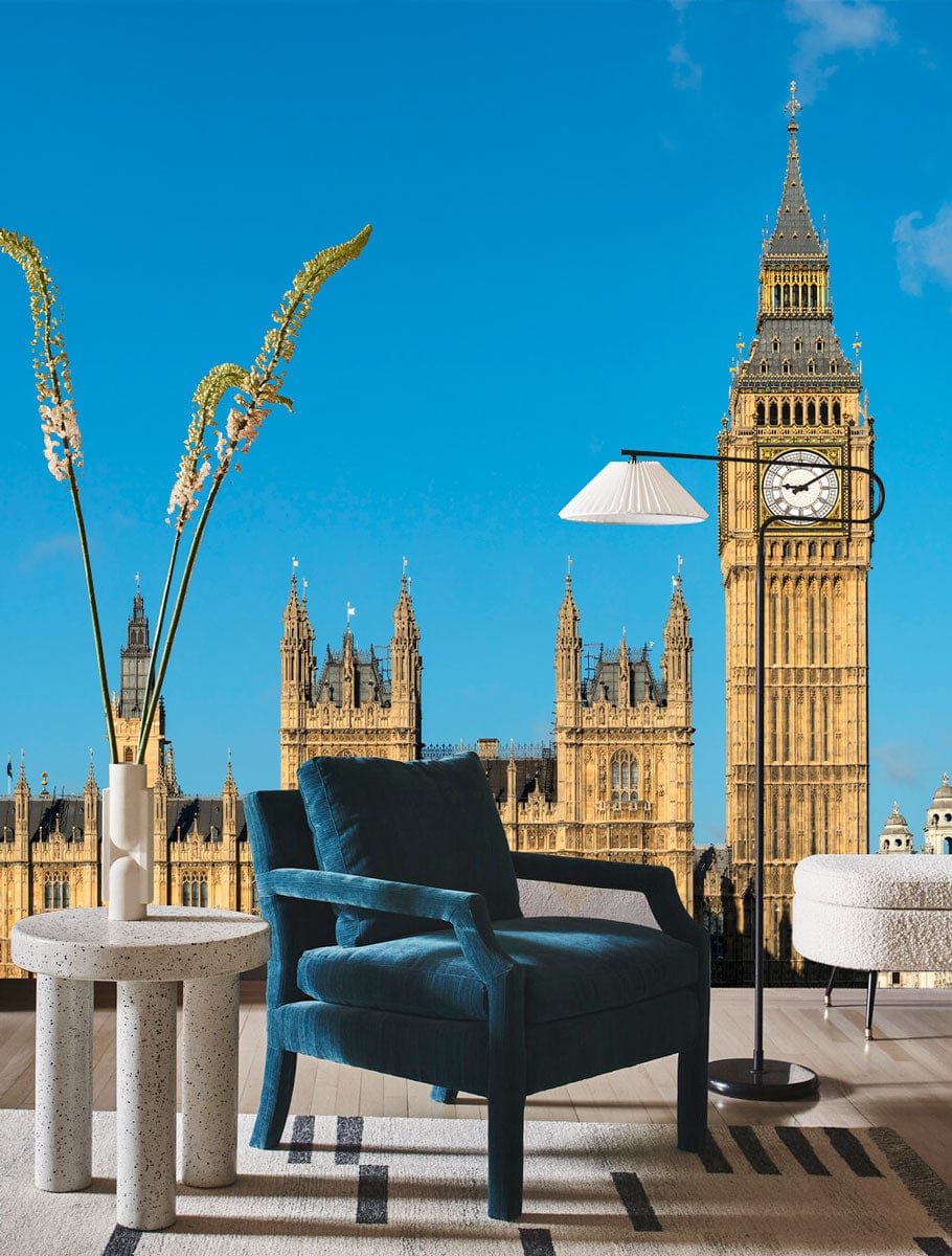 Iconic London mural wallpaper featuring Big Ben; blue chair, modern lamp, stylish living room decor.