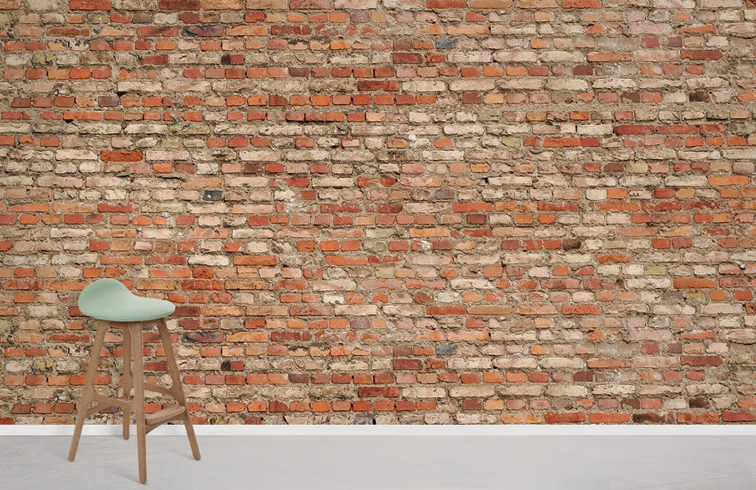 Rustic exposed brick wall mural wallpaper, warm earthy tones, wooden stool, modern minimalist decor.